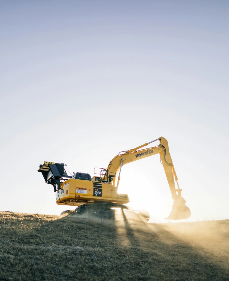 Heavy excavator at work in warm evening light